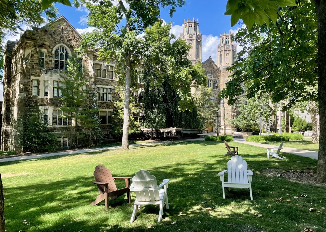 Adirondack chairs on the lawn below the University Center